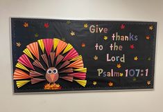 a bulletin board with a turkey on it and give thanks to the lord for thanksgiving