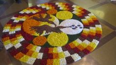 a decorated table top in the shape of a pumpkin