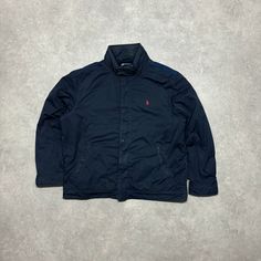 Vintage Polo Ralph Lauren navy fleece lined nylon jacket  Size - X-Large Width - 27' Length - 29' Long Sleeve Windbreaker With Fleece Lining For Cold Weather, Long Sleeve Nylon Windbreaker With Fleece Lining, Nylon Fleece Jacket With Pockets And Long Sleeves, Nylon Fleece Jacket With Pockets, Long Sleeve Nylon Fleece Jacket With Pockets, Winter Nylon Fleece Jacket With Long Sleeves, Casual Hooded Nylon Fleece Jacket, Weatherproof Long Sleeve Streetwear Outerwear, Casual Nylon Windbreaker With Fleece Lining