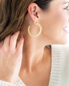 A hoop is quintessential to every southern jewelry box, but not all hoops are created equal. The brushed detail on our Textured Classic Hoops has a modern flair without stealing the spotlight from your outfit. Shiny and lightweight, these gold earrings will complement your wardrobe in every season. Modern Textured Gold Hoop Earrings, Elegant Textured Brass Jewelry, Chic Gold Hammered Hoop Earrings, Modern Textured Hoop Jewelry, Textured Hoop Earrings For Everyday Wear, Everyday Textured Hoop Earrings, Modern Textured Small Hoop Jewelry, Southern Jewelry, Susan Shaw