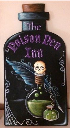 a bottle with an image of a skeleton in it and the words, the poison pen inn