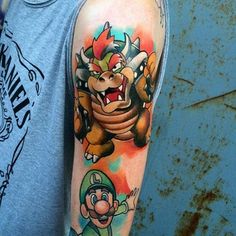 a man with a mario bros tattoo on his arm