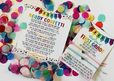 some confetti is laying on top of a card and paper with the words ready confetti written in it