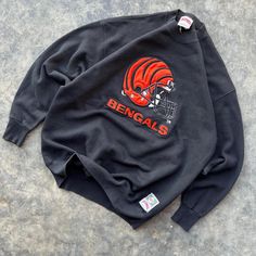 Vintage 90's NFL Football Cincinnati Bengals  Nutmeg Embroidered Crewneck Sweatshirt  Made in USA  23x29 Size XL approximately  Overall good vintage shape Rare Bengals Find  Excellent Embroidery Any questions feel free to reach out! Bengals Outfit Woman, 90s Style Crew Neck Sweatshirt With Embroidered Graphics, Vintage Crew Neck Sweatshirt With Embroidered Logo, 90s Embroidered Long Sleeve Sweatshirt, Vintage Embroidered Logo Tops For Winter, 90s Style Winter Sweatshirt With Embroidered Graphics, Vintage Crew Sweatshirt With Embroidery, 90s Embroidered Sweatshirt For Fall, Vintage Embroidered Logo Crew Neck Top