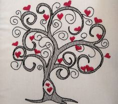 an embroidered tree with hearts on it