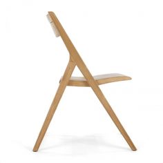 a wooden chair with a white seat and back rest on the bottom half of it