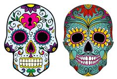 two sugar skulls with different designs on them