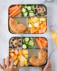 two trays filled with different types of food