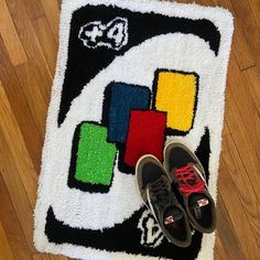 a pair of shoes sitting on top of a rug