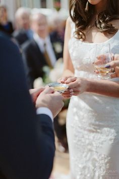 a bride and groom exchanging their wedding rings