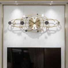 a large clock mounted to the side of a wall above a fire place in a living room