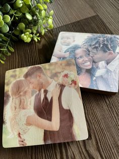 two wooden coasters with pictures of people on them and flowers in the back ground