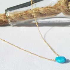 This turquoise necklace has a faceted turquoise gemstone that sits on a dainty 14k gold filled, sterling silver or 14k gold chain and lays below the collarbone. Subtle and simple, this beautiful semi-precious birthstone necklace is perfect by itself or for layering with other necklace. Turquoise is a December birthstone. Tiny seed pearls adorn the clasp giving the necklace a beautiful touch.  All necklaces are handmade by me in NYC and each necklace is made to order for you with only the hig... Sterling Silver Turquoise Faceted Necklace, Turquoise Faceted Briolette Necklaces, Turquoise Faceted Briolette Necklace, 14k Gold Turquoise Necklace For Gift, Dainty Yellow Gold Turquoise Necklace For Gift, Dainty Turquoise Necklace For Gift, Dainty Turquoise Jewelry In 14k Gold Filled, Dainty 14k Gold-filled Turquoise Jewelry, Dainty 14k Gold Filled Turquoise Jewelry