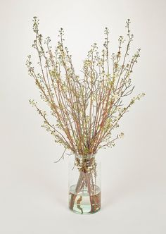 a vase filled with flowers on top of a table