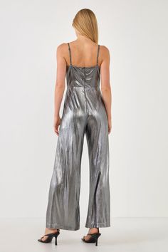 This Metallic Cowl Neck Cami Jumpsuit will be sure to keep you looking fashionable. This chic piece is designed with an all over metallic jersey fabric that contains a cowl neck cami bodice and an elastic band at the back for added comfort. It also features a center back zipper closure for easy on and off. This beautiful, one-of-a-kind jumpsuit is a must-have piece that is sure to elevate your wardrobe! Cowl neck cami bodice All over metallic jersey Elastic band at back bodice Center back zipper Sleek Summer Party Jumpsuits And Rompers, Glamorous Metallic Jumpsuits And Rompers For Night Out, Metallic Fitted Jumpsuits And Rompers For Party Season, Glamorous Metallic Jumpsuit For Night Out, Glamorous Fitted Jumpsuits And Rompers With Shimmer, Glamorous Fitted Shimmer Jumpsuits And Rompers, Metallic Sleeveless Jumpsuit For Night Out, Glamorous Metallic Shimmer Jumpsuits And Rompers, Shimmer Jumpsuits And Rompers For Party Season