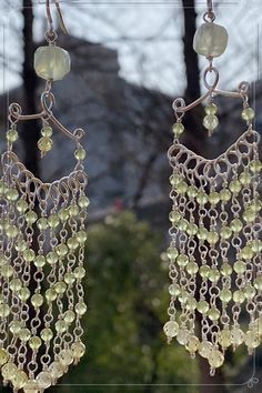 Adorn your ears with the soothing symphony of nature embodied in our Peridot Wind Chime Eardrops. Crafted with delicate wirewrap and vibrant peridot gemstones, these earrings evoke the gentle melodies of wind chimes, bringing harmony and elegance to your every movement.#longdropearring#wirewrap#wirejewelry#handmadejewelry#DIYearring#bohoearring#Beachstyle#Peridotjewelry#wire work Bohemian Dangle Wrap Earrings, Bohemian Dangle Wrap Earrings For Pierced Ears, Green Chandelier Earrings With Dangling Beads For Festivals, Nickel Free Green Bohemian Chandelier Earrings, Green Bohemian Chandelier Earrings Nickel Free, Handmade Lime Green Dangle Earrings, Green Nickel-free Bohemian Chandelier Earrings, Bohemian Wrap Dangle Earrings With Ear Wire, Bohemian Wrap Dangle Earrings