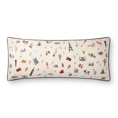 a rectangular pillow with animals and cars on it