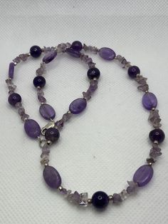 "18.1g Lobster 925 19\" 3/8 to 1/4 to 1/8 Round, oval, nugget chips, Sterling spacers This is a vintage, genuine purple amethyst and sterling silver necklace. The necklace is about 19 inches. The necklace features gorgeous, deep purple amethyst stones that are oval-cut, round-cut and nugget chips with sterling silver spacers. Very pretty. The necklace is about 3/8\" in width at the widest point then is 1/4\" and 1/8\" in width at other points. It weighs about 18.1 grams and is stamped 925. A sho Silver Amethyst Single Strand Necklace, Silver Amethyst Necklace With Single Strand, Silver Single Strand Amethyst Necklace, Amethyst Purple Necklaces Stamped 925, Purple Amethyst Necklaces Stamped 925, Purple Necklace Stamped 925 As Gift, Amethyst Stones, Necklace Ideas, Sterling Necklaces