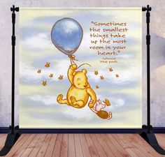 winnie the pooh holding onto a blue balloon that says sometimes he smallest things take up the most room in your heart