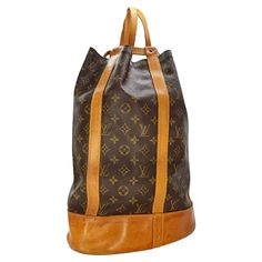 This Louis Vuitton Vintage Monogram Randonnee GM is a true statement piece. Made with exquisite detailing and Monogram canvas, its pure shape makes it an ideal city bag. Featuring a detachable interior pocket, this bucket bag is not only stylish but also functional. Retail price $1,600. Designer: Louis Vuitton Material: Monogram canvas w/ cowhide leather trim Date/Authenticity Code: A10994 Production Year: 1994 Origin: France Measurements: 16.75” W x 13” H x 6” D Strap Length: 15” Adjustable Interior Lining: canvas Pockets: One Removable Zip Pocket Opening/Closure: Open top with cinch strap Hardware: Golden color metallic pieces Includes: Entrupy Certificate Overall Condition: Very Good pre-owned vintage condition; shape has relaxed due to storing; exterior canvas is in great condition; le Louis Vuitton Vintage, Vintage Monogram, Vintage Bag, City Bag, Vintage Louis Vuitton, 6 D, Backpack Purse, Vintage Bags, Monogram Canvas