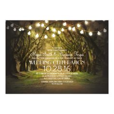 an outdoor wedding reception card with lights strung from the trees and stringing around it