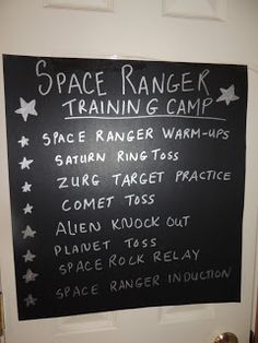 a chalkboard sign on the front door of a space ranger training camp