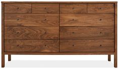 the chest of drawers is made out of wood and has six drawers, one with two doors