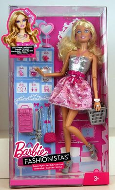 a barbie doll in a pink and silver dress holding a shopping basket with her hand