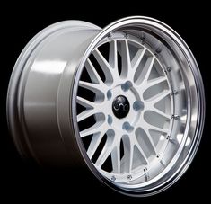 the wheel is shiny silver and has been painted with white spokes, while the rim is