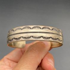 Vintage Navajo Native Stamp Work Sterling Silver Bracelet Cuff 6-1/2". Inner measurement from end-to-end is 5-3/4", with a 3/4" gap. Total inner circumference is 6-1/2". ---------------------------------------- All items, unless stated otherwise, are previously loved and used, showing scratches and slight imperfections (not brand new). Please refer to pictures for condition as they depict what you'll receive. If you have any questions, ask before purchasing. Note:   - Size and weight are approximate.   - "Vintage" is based on look and feel; items may be older (pre-1930s) or newer (post-1980s/1990s).   - We're not experts on stones. Refer to pictures for type and quality.   - "Southwestern" items reflect that style, possibly from Navajo, Zuni, Hopi, etc.   - "Sterling" items are tested to b Traditional Adjustable Cuff Bracelet With Concho, Western Style Stamped Cuff Bracelet, Southwestern Adjustable Cuff Bracelet, Adjustable Southwestern Cuff Bracelet, Bohemian Adjustable Untreated Bracelets, Southwestern Style Adjustable Stamped Bangle, Southwestern Style Adjustable Etched Bracelets, Silver Bracelet Cuff, Bracelet Cuff