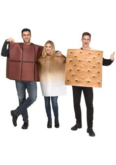 three people in costumes holding up signs