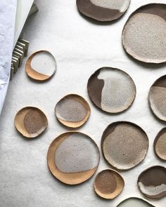 several wooden spoons with white and brown designs on them