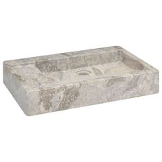 a large stone sink sitting on top of a counter