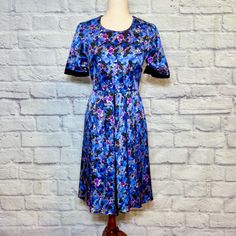 *Classic Erdem Print Dress *Round Neck *Short Sleeves *Pleated In Front *80% Silk, 20% Cupro; Lining 100% Viscose *Size 6 Measurements: Bust=33.5, Length=35.5, Waist=27.5 Blue Silk Midi Dress With Short Sleeves, Short Sleeve Blue Silk Midi Dress, Fitted Purple Midi Dress With Short Sleeves, Purple Silk Dress For Daywear, Purple A-line Midi Dress With Floral Print, Purple Fitted A-line Midi Dress, Fitted Mid-length Purple Dress, Purple Fitted Mid-length Dress, Blue Floral Print Midi Dress Fit And Flare