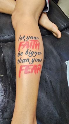 a person with a tattoo on their leg that says, let your farm be bigger than your fear