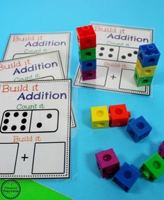 building blocks and addition cards on a table