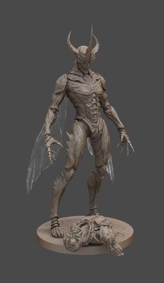 a statue of a creature with wings on it's head and legs, standing in front of a gray background