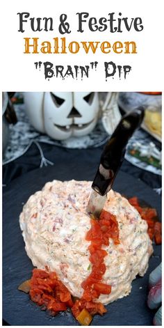 an image of a halloween dip with tomatoes and cheese in it on a black plate