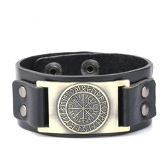 a black leather bracelet with an emblem on it