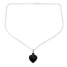 A sparkling garnet watches over an onyx heart in the powerful design of this necklace by Shanker. He crafts the sterling silver necklace by hand with the gems of love and protection. .925 Sterling silver Garnet Black Jewelry For Gift, Gothic Pendant Jewelry For Valentine's Day, Gothic Heart-shaped Anniversary Jewelry, Gothic Sterling Silver Gemstone Jewelry, Gothic Heart Pendant Jewelry As Gift, Gothic Jewelry For Valentine's Day Formal, Black Sterling Silver Jewelry With Heart Charm, Garnet Gemstone Jewelry For Valentine's Day, Black Sterling Silver Jewelry For Valentine's Day