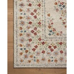 a white rug with flowers on it