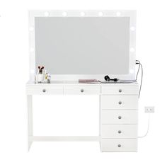 a white vanity with lights and drawers