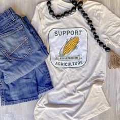 Tan tshirt that says support agriculture on it with a corn cob in the middle. Ask a Farmer Agriculture Tshirts, Roots Clothing, Farm Tshirt, Agriculture Industry, Country Fashion, A Farmer, On The Farm, Clothing Co, The Farm