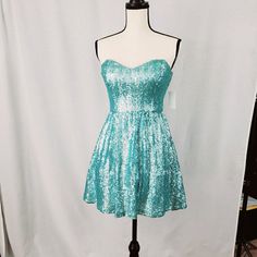 This Is A Brand New With Tags Bought From Dillards Dress. Newer Worn, Want To Be A Mermaid, This Is The Dress. It's Shines And Has Some Tull Underneath To Give It Some Structure. Perfect For Spring. It Is Also Hand Washable For Added Bonus. Blue Sequined Strapless Dress, Blue Strapless Sequin Dress, Blue Strapless Mini Dress For Party Season, Blue Strapless Dress For Party Season, Blue Fitted Strapless Dress For Homecoming, Fitted Blue Dress For Dress-up Occasions, Fitted Light Blue Strapless Dress For Party, Fitted Light Blue Dress For Dress-up, Blue Sequined Dress For Dress-up Occasions