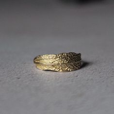 a gold ring sitting on top of a table