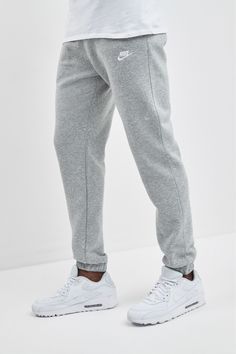 The Nike Sportswear Club Fleece Joggers combine classic style with the soft comfort of fleece. Soft Comfort Brushed-back fleece fabric feels soft and smooth. Secure Fit Elastic waistband with an adjustable drawcord lets you personalize the fit. Elastic at the cuffs lets you show off your kicks. More Details Fabric: Body/side pocket palm side: 80-82% cotton/18-20% polyester. Side pocket knuckle side: 100% cotton. Back pocket: 100% cotton. Machine wash Imported Note: Material percentages may vary depending on factory. 81% Cotton, 19% Polyester. Nike Grey Sweatpants Outfit Men, Jogger Outfit Men, Nike Joggers Outfit, Nike Sweatpants Outfit, Gray Sweatpants Outfit, Nike Grey Sweatpants, Drip Ideas, Grey Nike Joggers, Jogging Nike