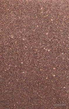 an image of some brown glitter on the ground with small dots in it's center