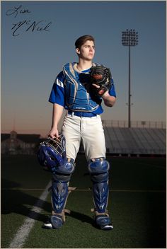 a baseball player is posing with his catchers mitt and glove on the field