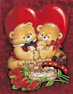 two teddy bears sitting next to each other in front of a heart