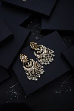 This beautifully handcrafted earrings is set in silver and copper alloy and plated with 22k gold. DETAILS Length - 7.5 cm Closure - Push Back STYLE TIP We love teaming this with classy chiffon sarees or zari silk sarees. Also looks best when worn with your royal whites, off whites and gold. We recommend styling with pastel solids or floral dresses in peachy pink, pistachio green and pastel blue too. Perfect for them Red weddings or banarasi sarees. This is a perfect solution to your pastel weddi Bollywood Chandbali Earrings For Ceremonies, Fusion Chandbali Earrings With Latkans, Fusion Style Chandbali Earrings With Latkans, Fusion Style Chandbali Earrings For Ceremonies, Fusion Style Chandbali Earrings For Ceremonial Occasions, Fusion Style Drop Earrings For Festivals, Fusion Brass Earrings For Festivals, Festival Fusion Brass Earrings, Silver Kundan Hoop Earrings For Gift